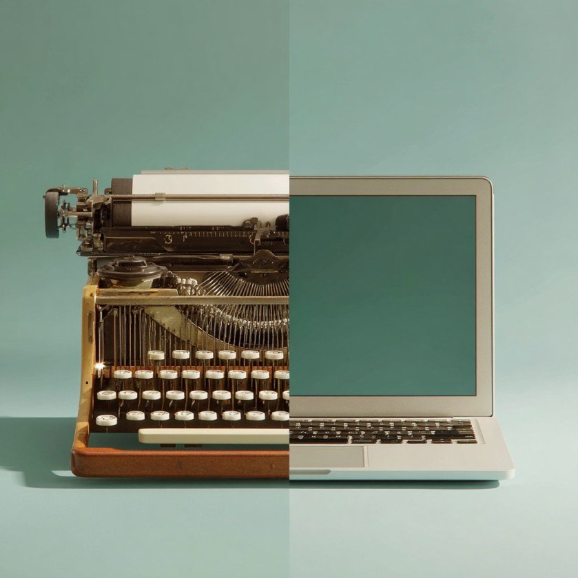 Half a vintage typewriter and half a modern laptop